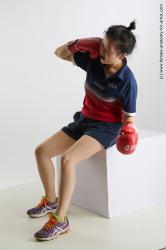 Sportswear Woman Asian Sitting poses - ALL Average medium black Sitting poses - simple Fighting Standard Photoshoot Academic