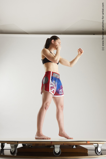 Sportswear Woman White Slim long brown Fighting Multi angle poses Academic