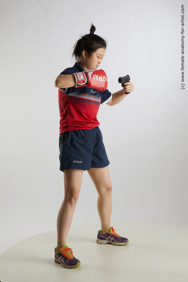 Sportswear Fighting with gun Woman Asian Standing poses - ALL Average medium black Standing poses - simple Standard Photoshoot Academic
