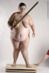 Nude Fighting with sword Woman White Standing poses - ALL Overweight medium brown Standing poses - simple Pinup