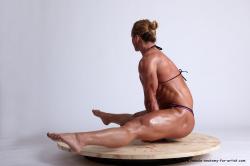 Swimsuit Gymnastic poses Woman White Sitting poses - ALL Muscular medium blond Sitting poses - simple Academic