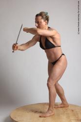Swimsuit Fighting with knife Woman White Standing poses - ALL Muscular medium brown Standing poses - simple Academic