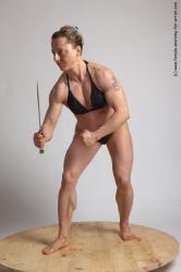 Swimsuit Fighting with knife Woman White Standing poses - ALL Muscular medium brown Standing poses - simple Academic
