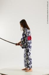 Casual Fighting with sword Woman Asian Sitting poses - ALL Slim medium black Sitting poses - simple Standard Photoshoot Academic