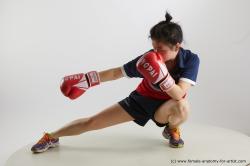 Sportswear Woman Asian Kneeling poses - ALL Average Kneeling poses - on one knee medium black Fighting Standard Photoshoot Academic