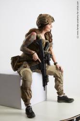 Fighting with gun Woman White Sitting poses - ALL Slim long brown Sitting poses - simple Standard Photoshoot Academic